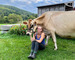 Sophie roe of green acres farm and creamery with a jersey cow