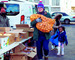 a volunteer carries onions with harvesting good